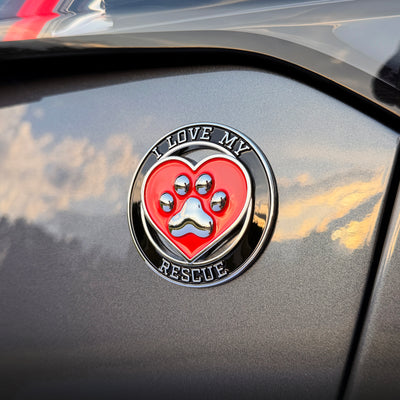 the I LOVE MY RESCUE BADGE on a car
