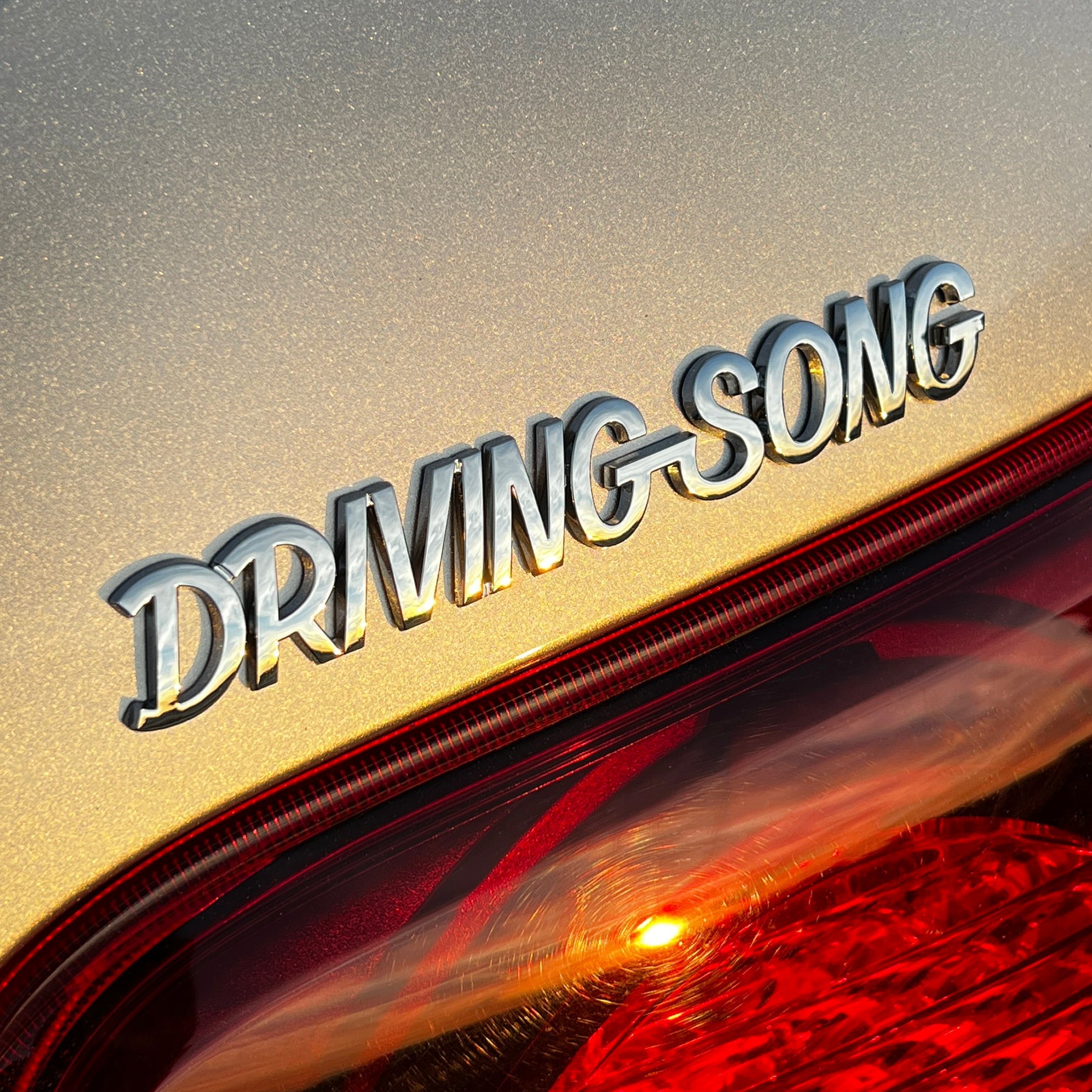 the DRIVING SONG BADGE - Grateful Fred - Vehicle Emblems & Hood Ornaments