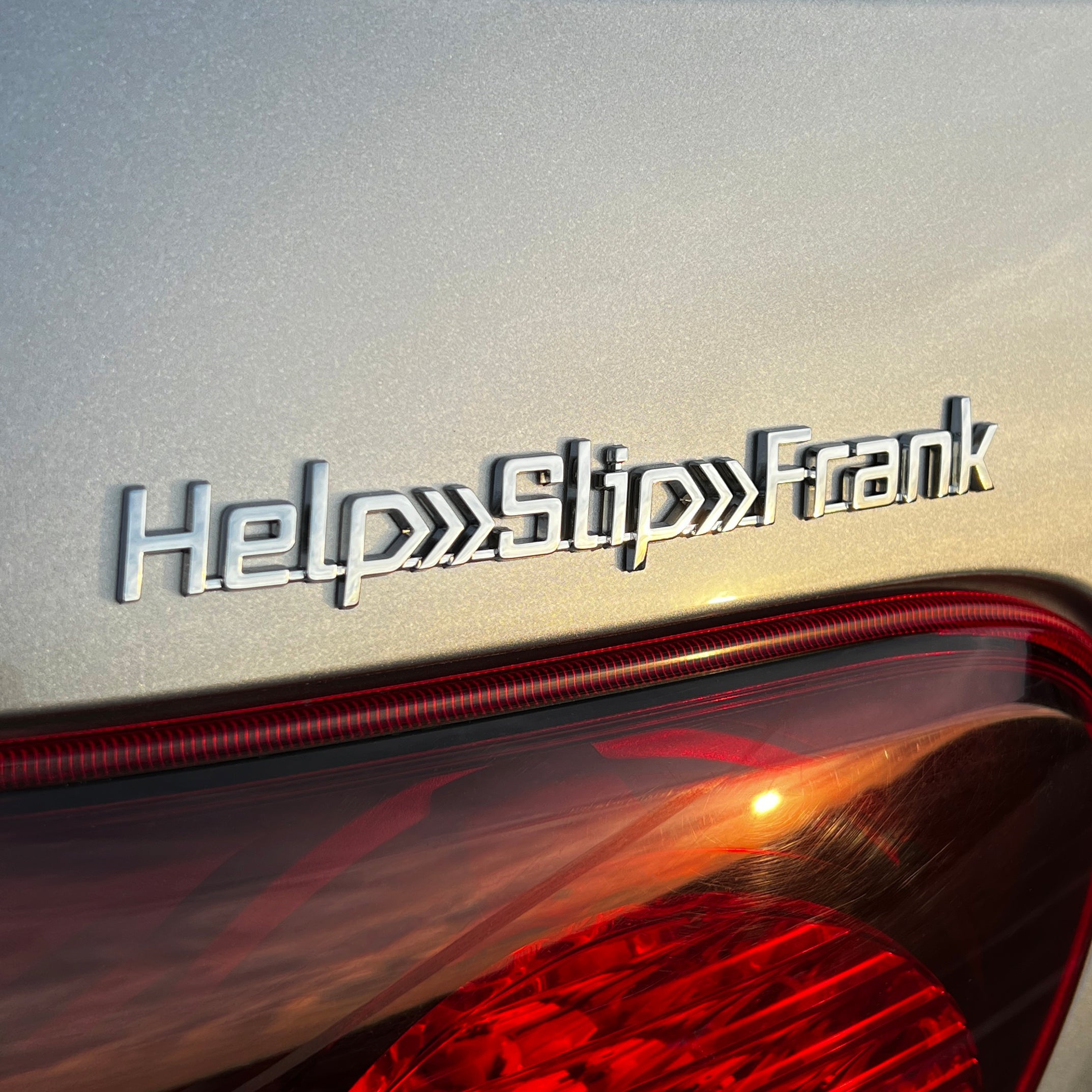 the HELP>SLIP>FRANK BADGE - Grateful Fred - Vehicle Emblems & Hood Ornaments