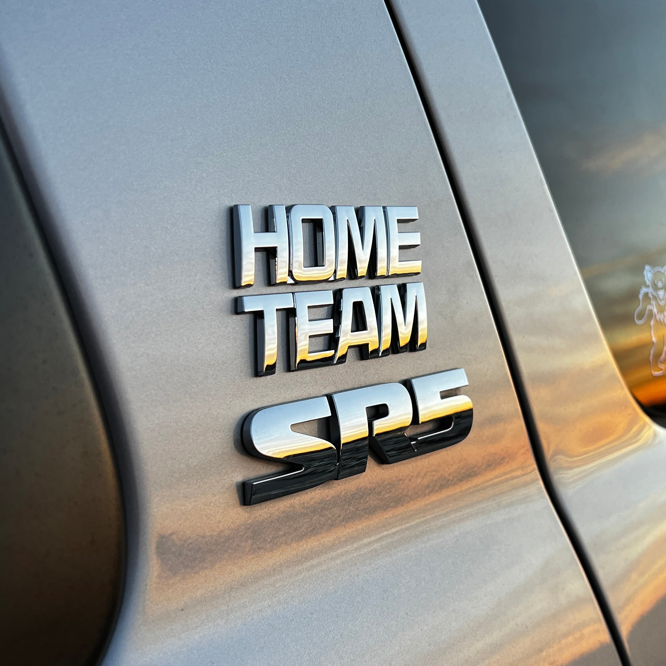 the HOME TEAM BADGE - Grateful Fred - Vehicle Emblems & Hood Ornaments