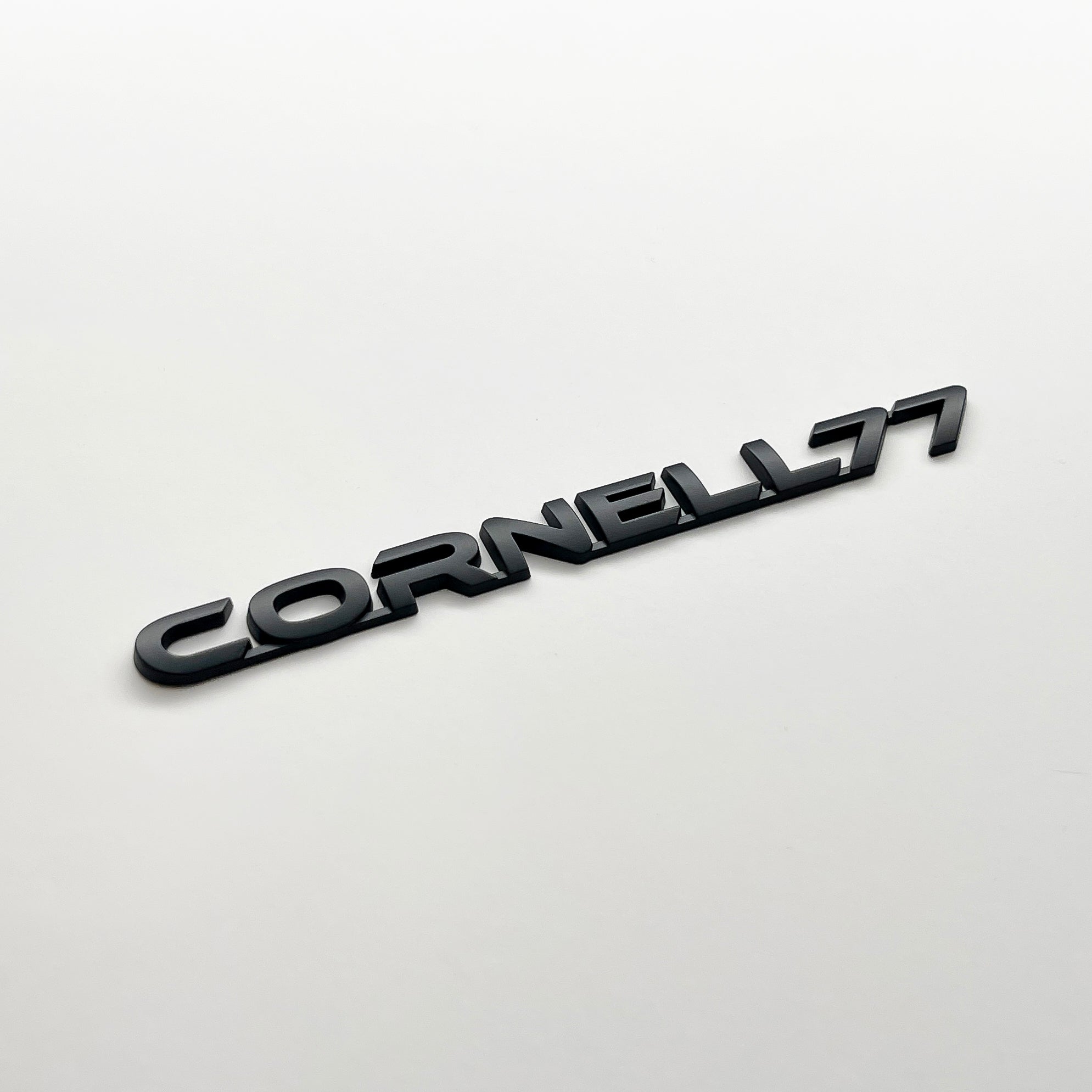 the CORNELL 77 BADGE - Grateful Fred - Vehicle Emblems & Hood Ornaments