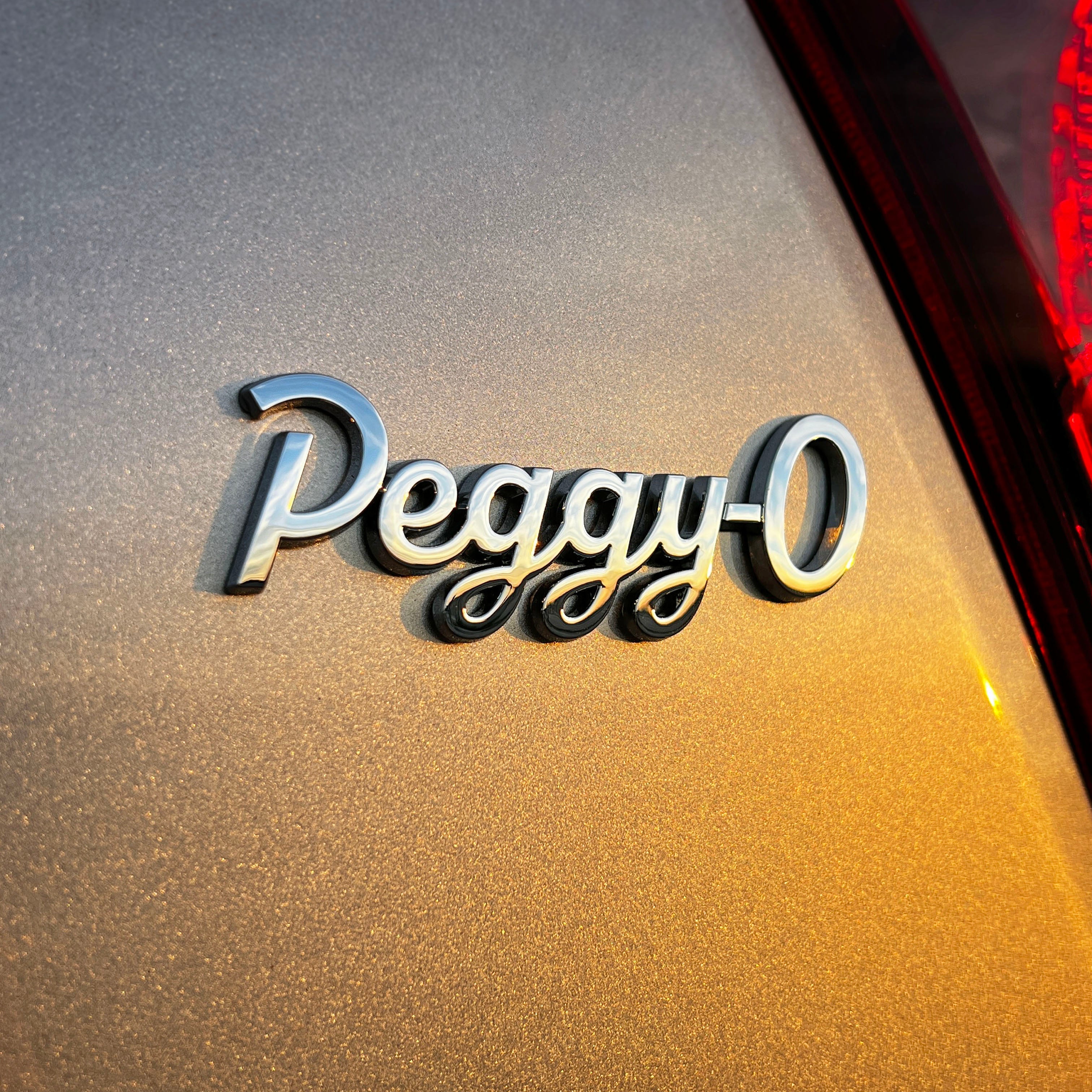 the PEGGY-O BADGE - Grateful Fred - Vehicle Emblems & Hood Ornaments