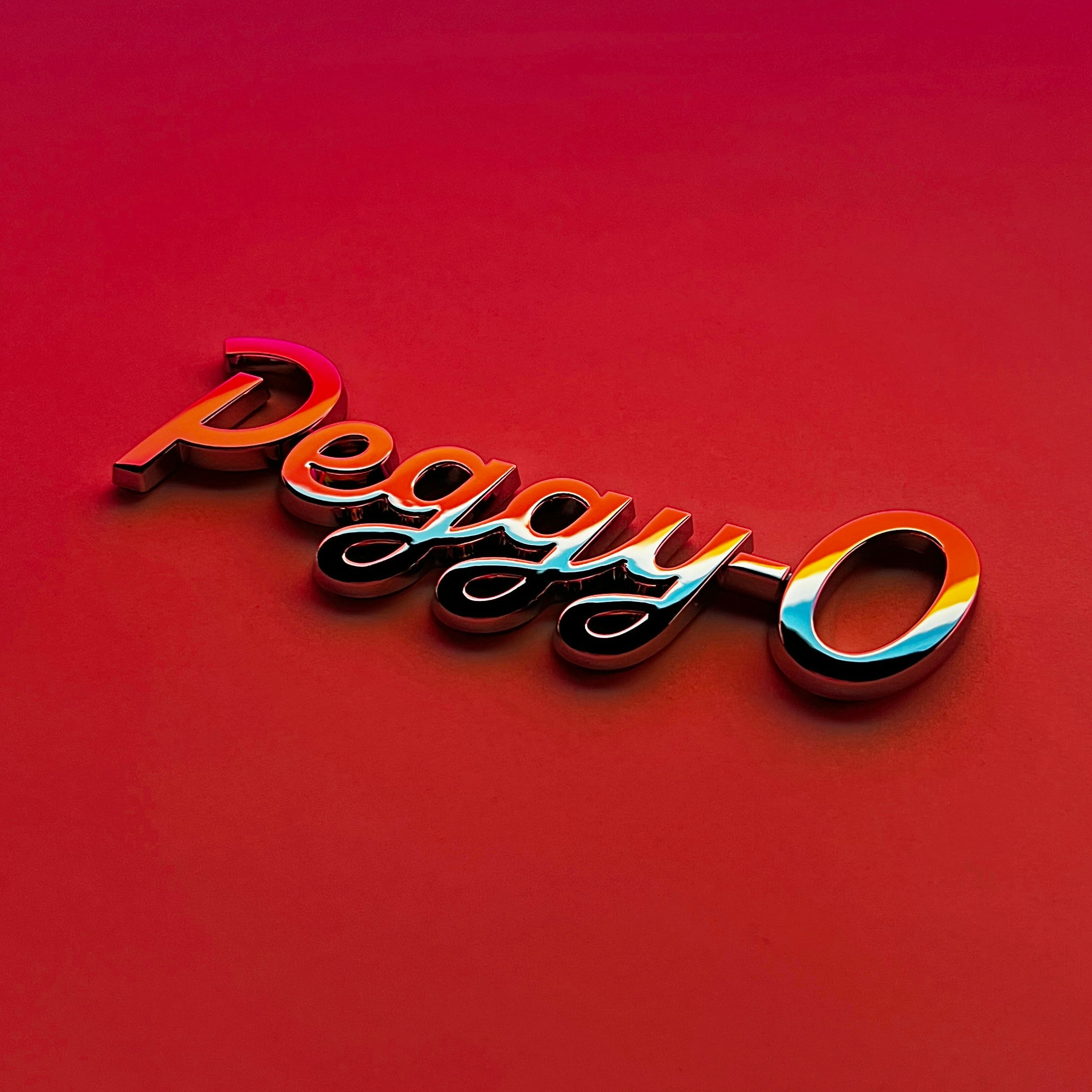 the PEGGY-O BADGE - Grateful Fred - Vehicle Emblems & Hood Ornaments