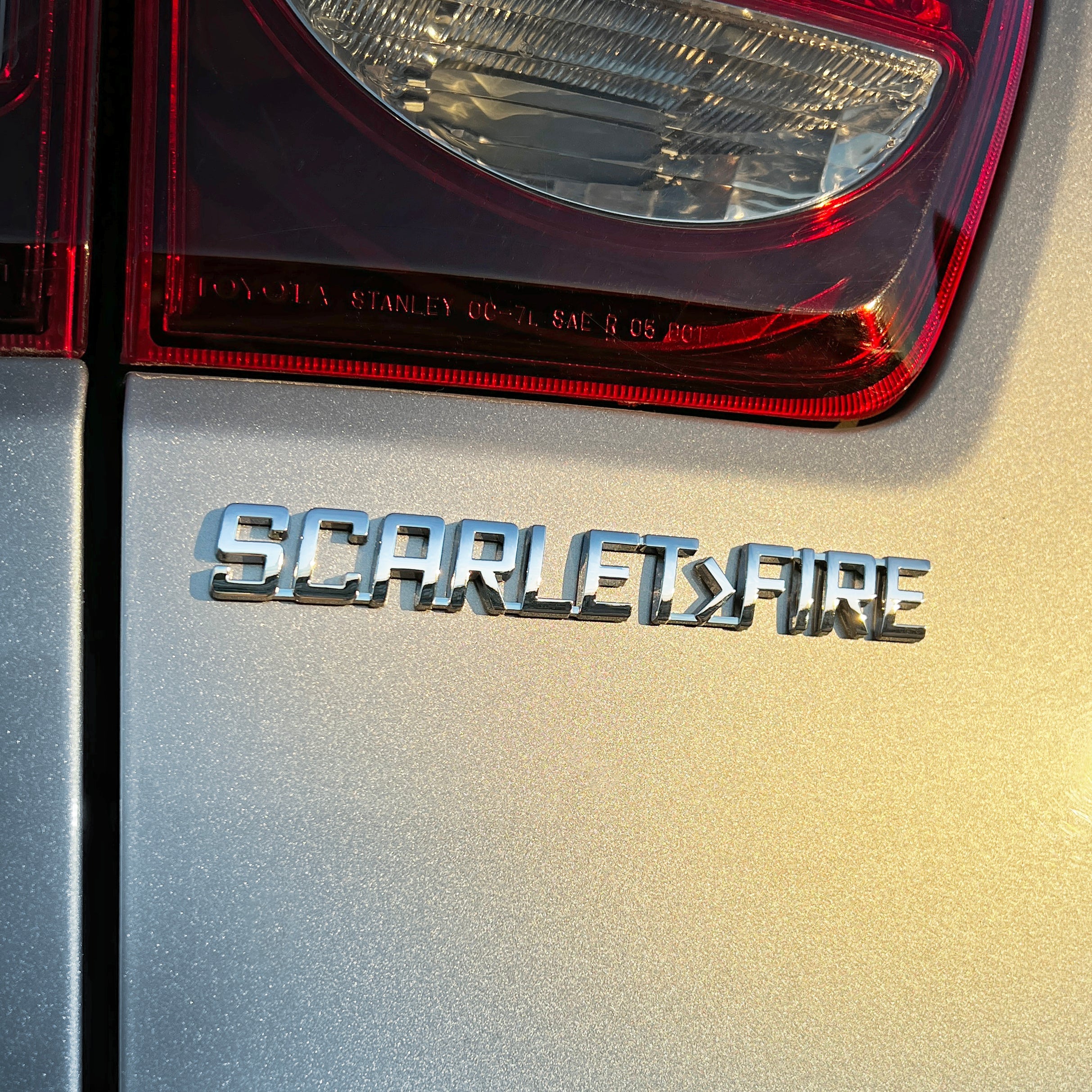 the SCARLET>FIRE BADGE - Grateful Fred - Vehicle Emblems & Hood Ornaments