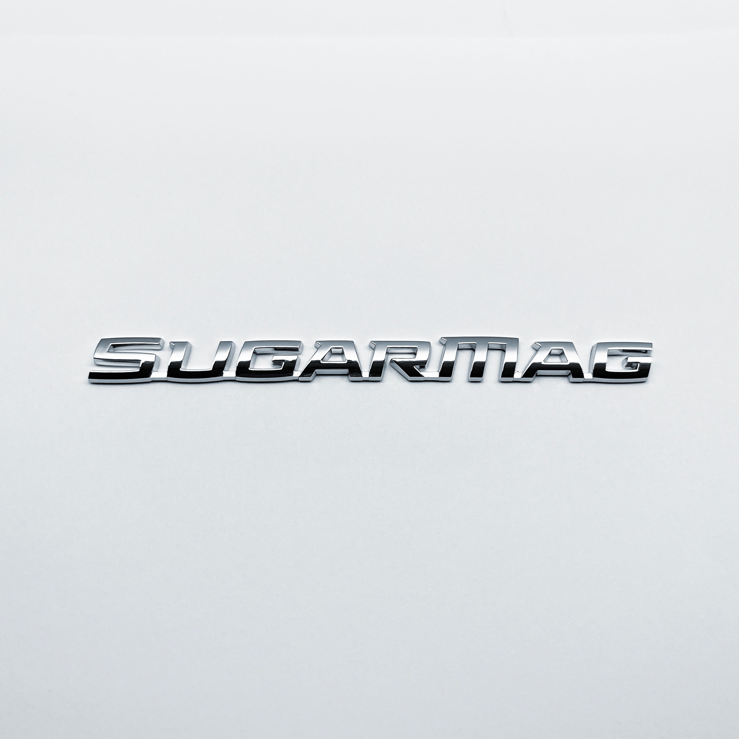 the SUGAR MAG BADGE - Grateful Fred - Vehicle Emblems & Hood Ornaments