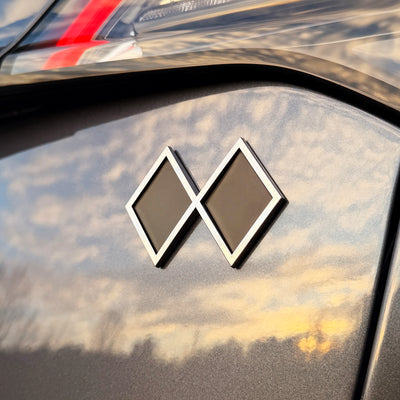 the DOUBLE BLACK DIAMOND BADGE
