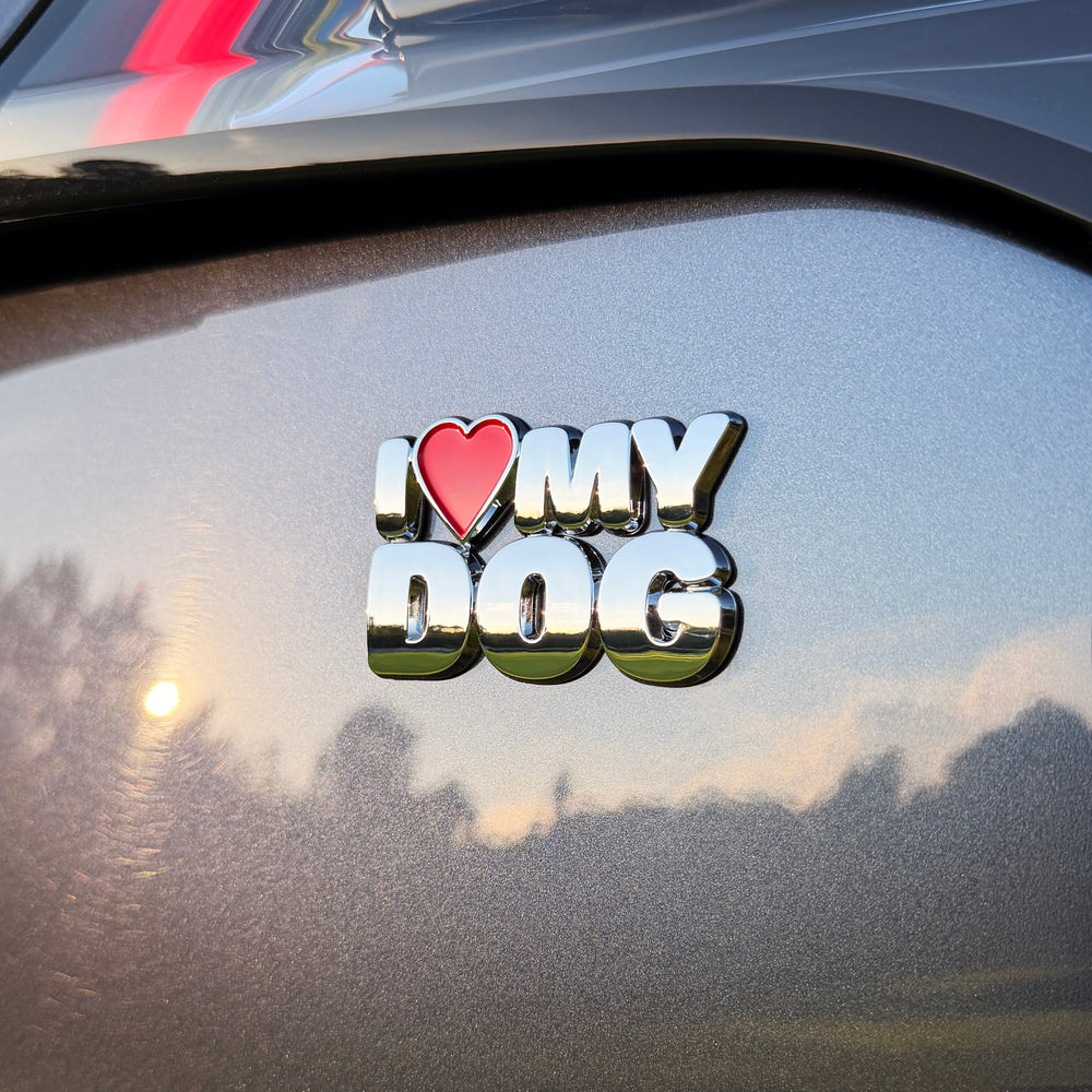 the I ♥️ MY DOG BADGE on the back of a car