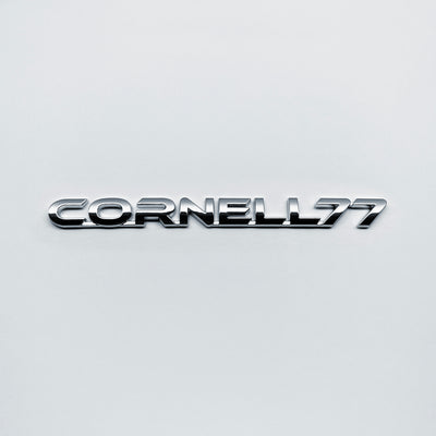 the CORNELL 77 BADGE