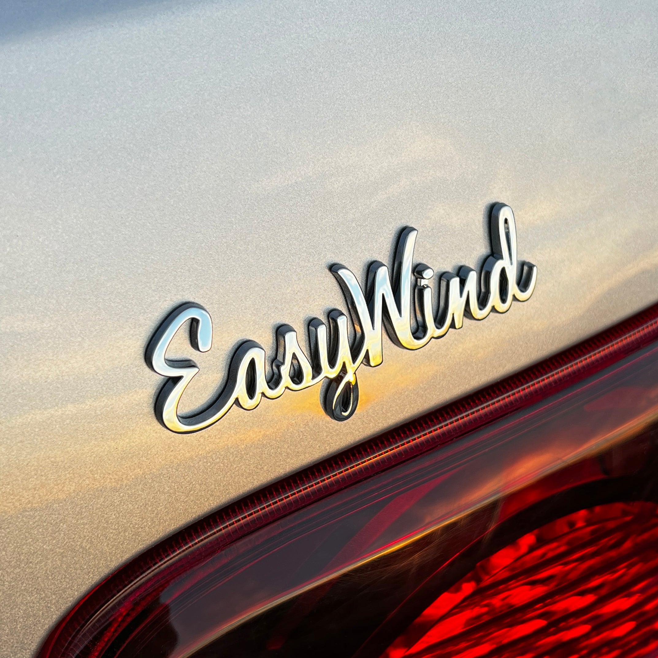 the EASY WIND BADGE - Grateful Fred   - Vehicle Emblems & Hood Ornaments