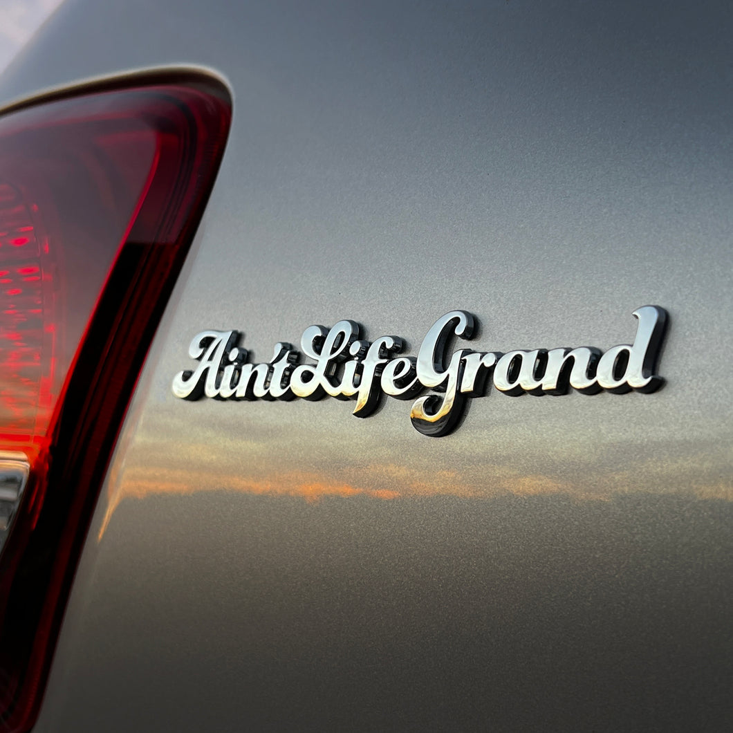 the AIN'T LIFE GRAND BADGE - Grateful Fred   - Vehicle Emblems & Hood Ornaments