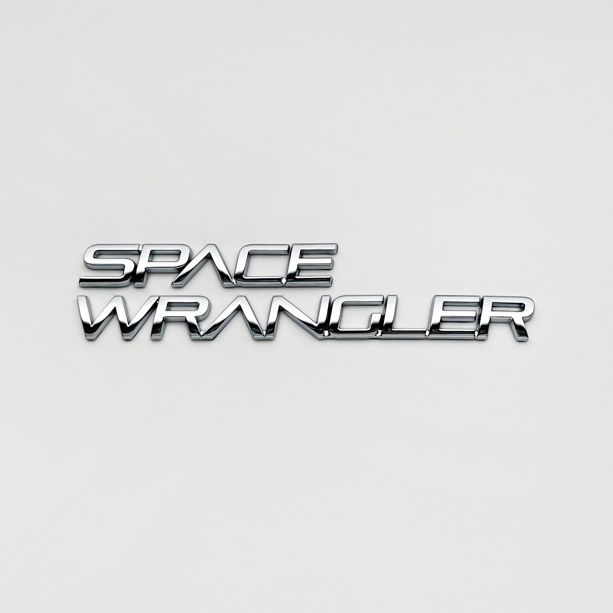 the SPACE WRANGLER BADGE - Grateful Fred   - Vehicle Emblems & Hood Ornaments