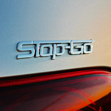 Load image into Gallery viewer, the STOP-GO BADGE - Grateful Fred   - Vehicle Emblems &amp; Hood Ornaments
