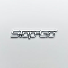 Load image into Gallery viewer, the STOP-GO BADGE - Grateful Fred   - Vehicle Emblems &amp; Hood Ornaments
