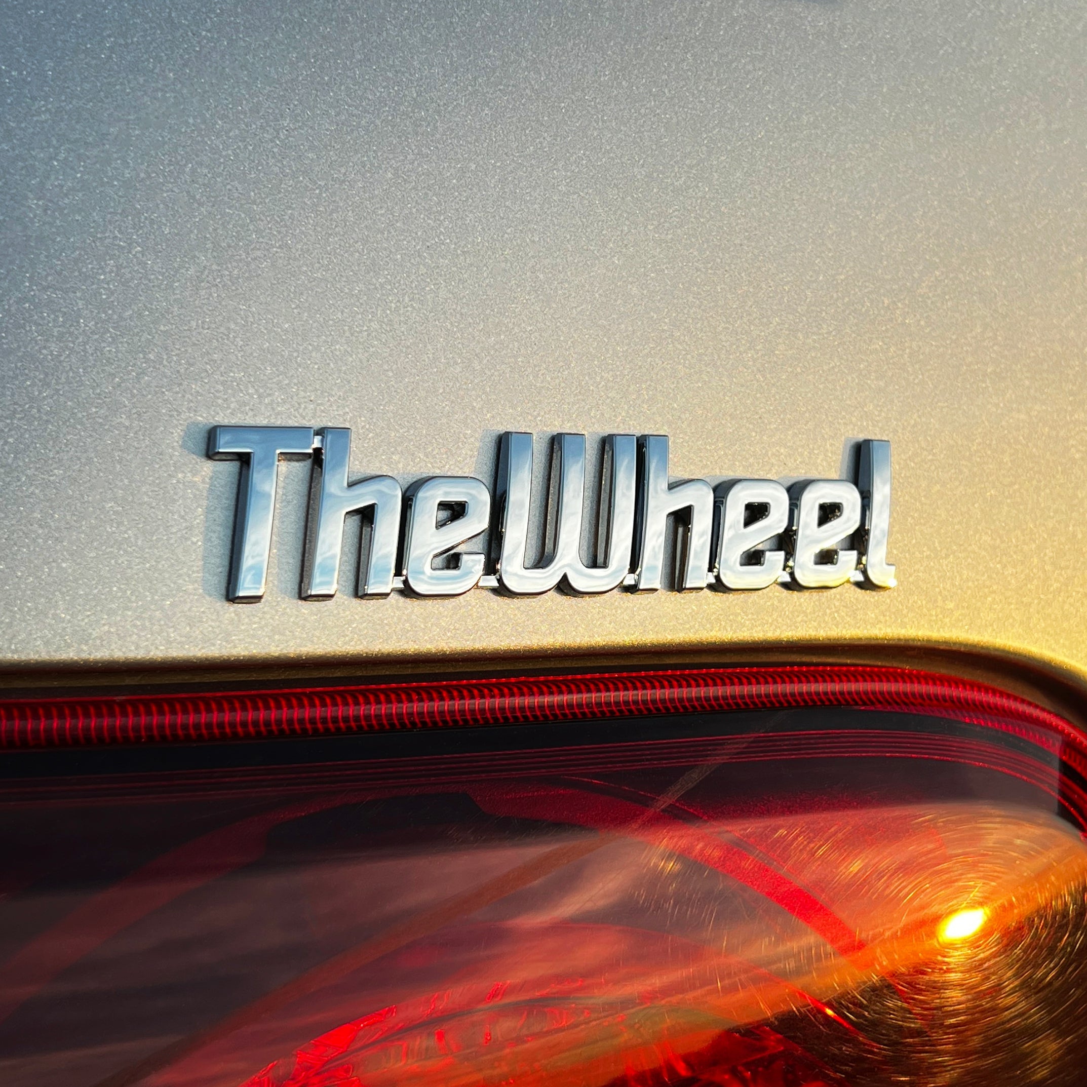 the WHEEL BADGE - Grateful Fred   - Vehicle Emblems & Hood Ornaments