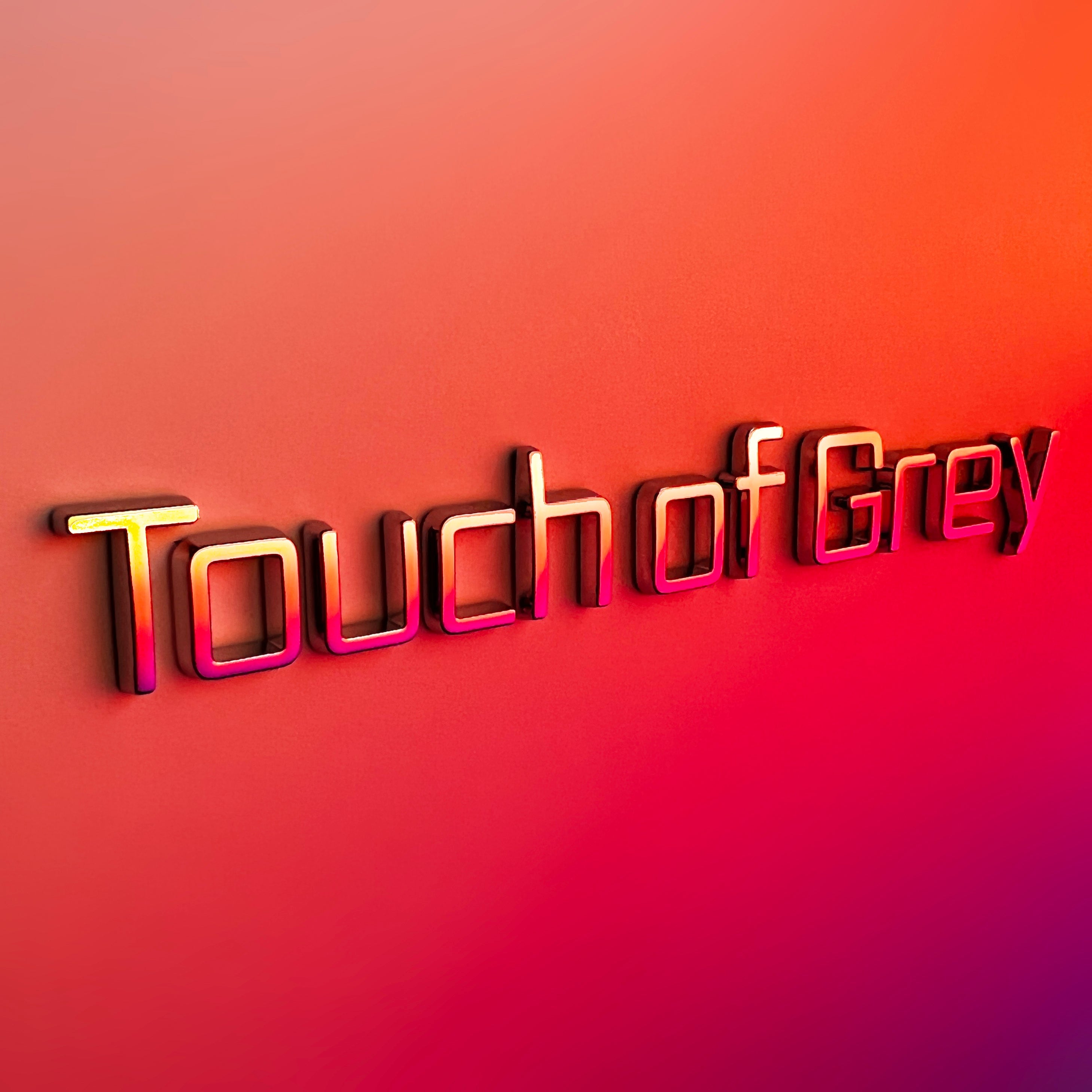 the TOUCH OF GREY BADGE - Grateful Fred   - Vehicle Emblems & Hood Ornaments
